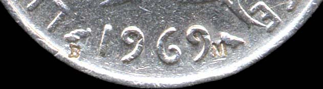 Surfrappe B et M sur 1 franc 1969 - plan serr
