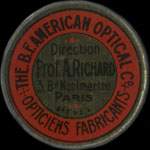 Timbre-monnaie American Optical - Direction Prof. A.Richard - 3 Bd Montmartre - Paris - 10 centimes rouge sur fond rouge - avers