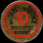 Timbre-monnaie Aux Dames de France - Nouveautés - Bordeaux - 10 centimes rouge sur fond doré - (décentré) - avers