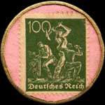 Timbre de 100 pfennig vert sur fond rose