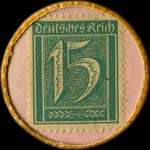 Timbre de 15 pfennig vert sur fond rose