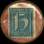 Timbre de 15 pfennig bleu-vert sur fond rose