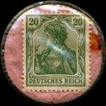 Timbre de 20 pfennig vert sur fond rose